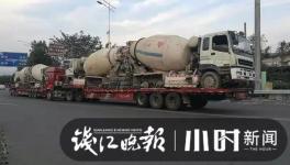 巨無霸來了！半掛車“背”著水泥車欲上高速！